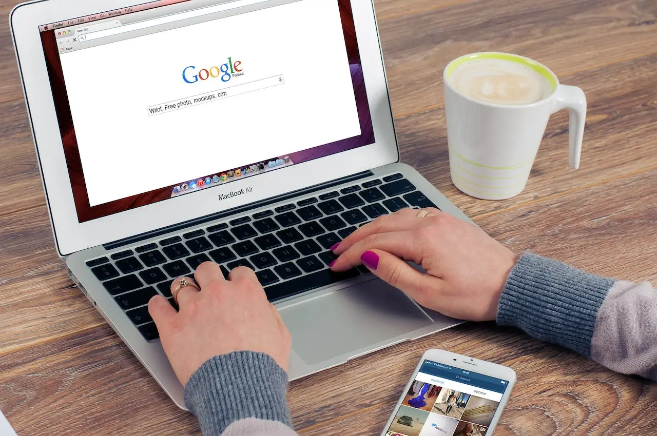 Women typing google sandboc in google search